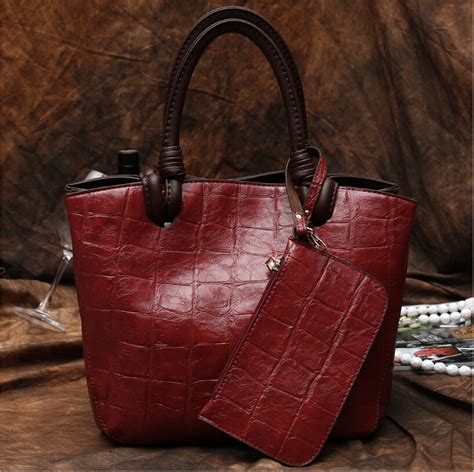 least expensive designer leather purses